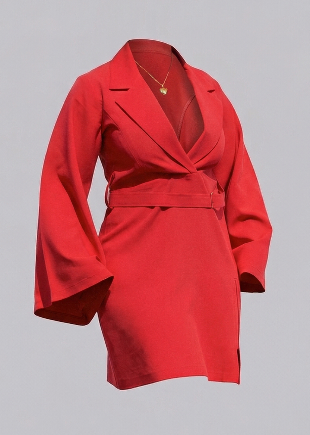 Red dress with a necklace and high heels on a gray background